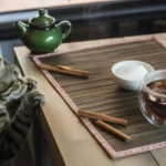 Cat looking curiously at a cinnamon stick, exploring safe food options.